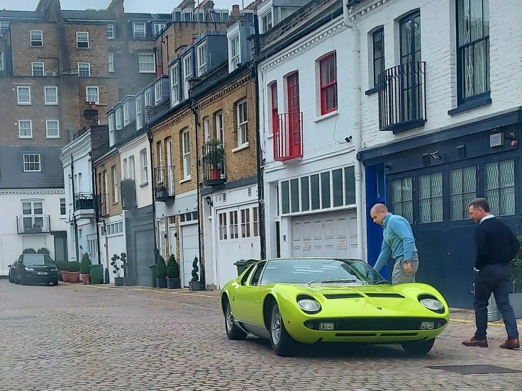 Christian Horner getting into a green Lamborghini Miura.