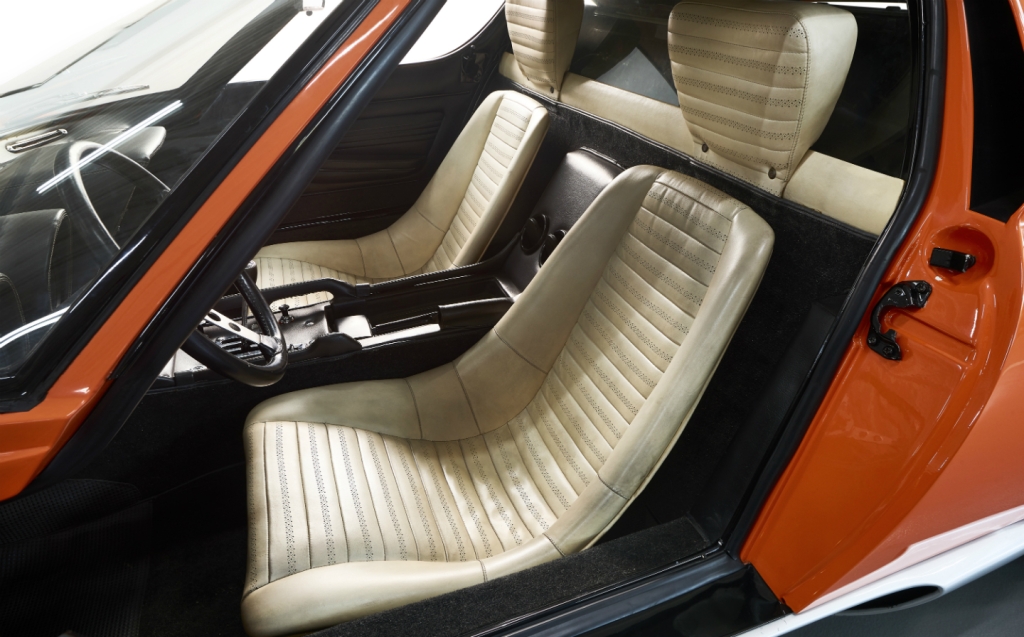 The interior of the Italian Job Miura has white leather seats.